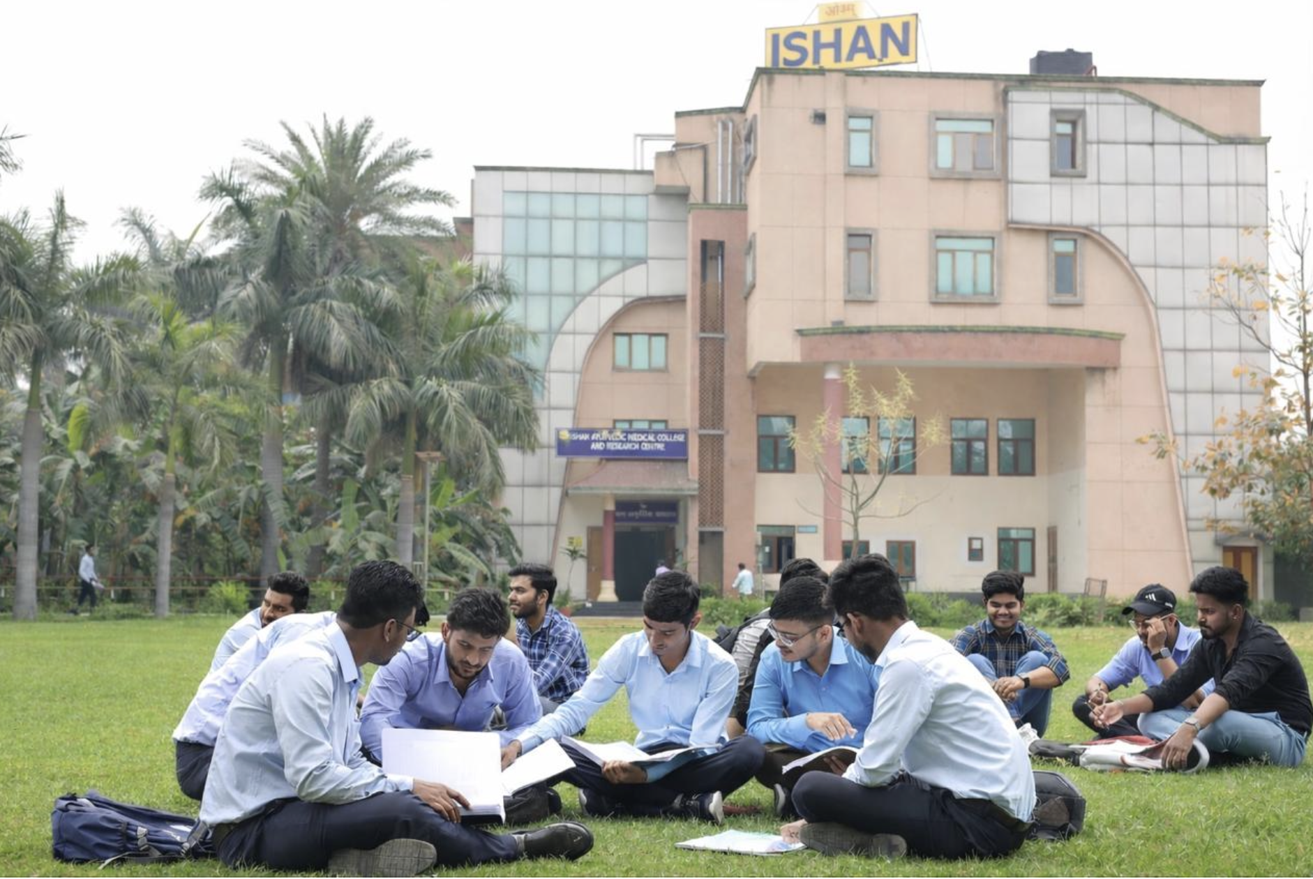 Students with faculty in garden